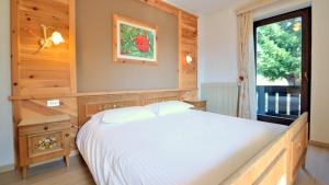 Postel nebo postele na pokoji v ubytování Hotel Garni Edy