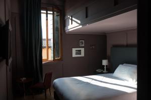 Postel nebo postele na pokoji v ubytování Hotel 5 Colonne