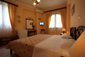 Säng eller sängar i ett rum på Sofia Pension