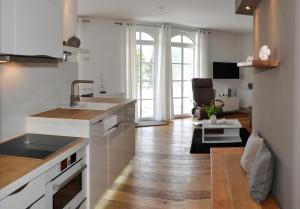a kitchen with a sink and a counter top at Meereszeichen in Baabe
