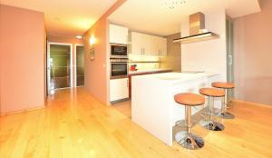 Kuchyň nebo kuchyňský kout v ubytování Résidence RoyAlp - Appartement 22A