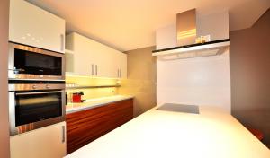 Kuchyň nebo kuchyňský kout v ubytování Résidence RoyAlp - Appartement 22A + 11 fotografií
