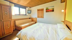 Postel nebo postele na pokoji v ubytování Hotel Garni Edy