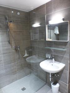 a bathroom with a shower and a sink and a shower at Chalet Auszeit in Arzl im Pitztal