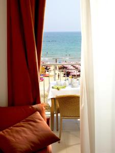a hotel room with a view of the ocean at Casa Del Mar in Roseto degli Abruzzi