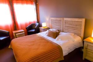Un ou plusieurs lits dans un hébergement de l'établissement Almoria Hôtel & SPA