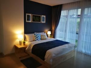 Giường trong phòng chung tại Centara Avenue Residence by Patsamon +45 ảnh