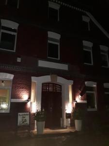 a house at night with a sign in front of it at Bredenbecker Hof in Wennigsen