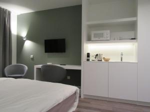 Kuchyň nebo kuchyňský kout v ubytování Hotel Muske Pitter