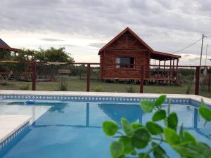 The swimming pool at or close to Cabañas SOLANAS