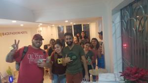 a group of people standing in a room at City Backpackers Hostel in Ho Chi Minh City