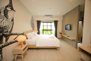 Bunprasop Garden Hotel客房内的一张或多张床位