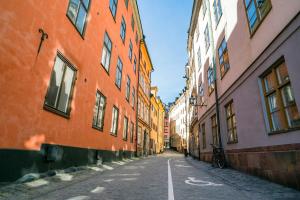an empty street in an alley between buildings at Castle House Inn in Stockholm