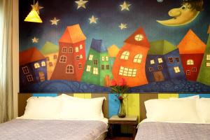 Katil atau katil-katil dalam bilik di Outingfun Bed and Breakfast