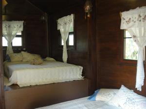 Postel nebo postele na pokoji v ubytování Sangsawang Resort