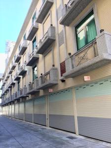a row of garage doors on the side of a building at New Bale Motel in Bali