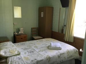 Кровать или кровати в номере Cavendish House