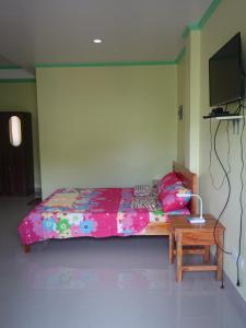 Katil atau katil-katil dalam bilik di La Fela Pension House
