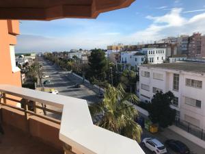 a balcony with a view of a city street at Infantes 8-4-30 in Sanlúcar de Barrameda