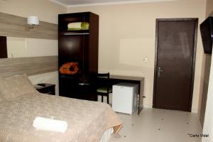 Łóżko lub łóżka w pokoju w obiekcie Hotel Monte Libano