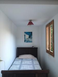 Giường trong phòng chung tại La Casita Peñablanca