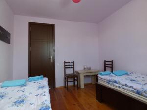 Ένα ή περισσότερα κρεβάτια σε δωμάτιο στο Anano Guest House