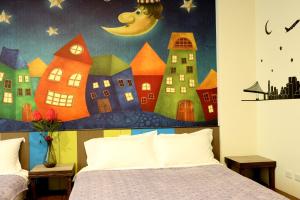 Katil atau katil-katil dalam bilik di Outingfun Bed and Breakfast