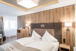 Ένα ή περισσότερα κρεβάτια σε δωμάτιο στο Hotel Mondin