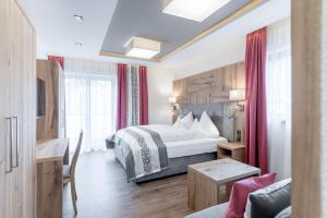 Ένα ή περισσότερα κρεβάτια σε δωμάτιο στο Hotel Mondin