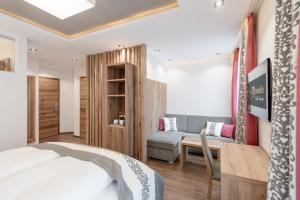 Ένα ή περισσότερα κρεβάτια σε δωμάτιο στο Hotel Mondin