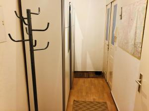 a hallway with a large refrigerator in a room at Ferienwohnung Tiffy in Chemnitz