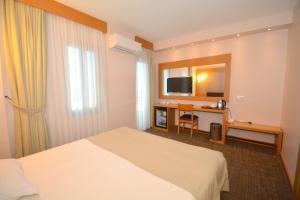a hotel room with a bed and a desk at Istankoy Hotel in Kusadası +71 photos