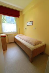Ліжко або ліжка в номері Haus Burgman Bad Gastein - appartement met 4 slaapkamers