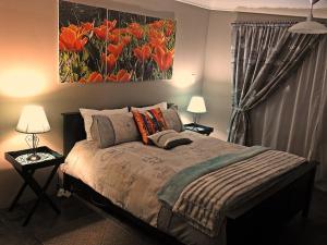 Postel nebo postele na pokoji v ubytování Apricity Inn