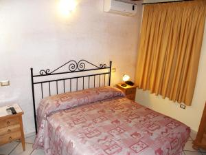 Postel nebo postele na pokoji v ubytování Agriturismo La Colombaia