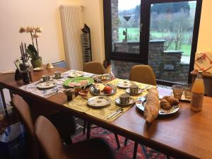 a wooden table with food on top of it at fermette in Lontzen