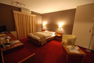 Postel nebo postele na pokoji v ubytování Hotel Amadeus