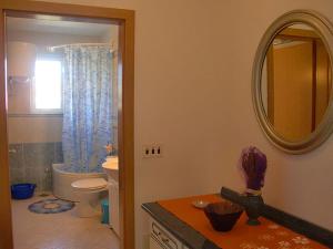 a bathroom with a toilet and a mirror at Apartment Marina in Slatine +38 photos