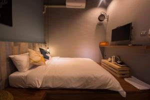 Voodi või voodid majutusasutuse Meet the Bay Homestay toas