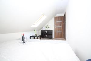 Łóżko lub łóżka w pokoju w obiekcie Apartamenty Trzciana