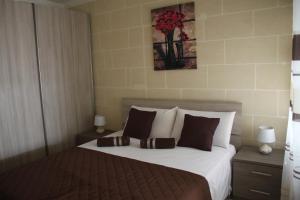 Postel nebo postele na pokoji v ubytování St Joseph Penthouse