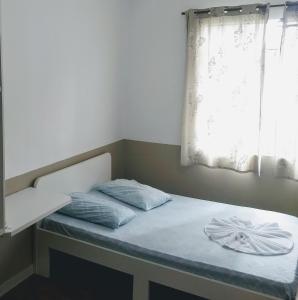 Postel nebo postele na pokoji v ubytování Hotel Aruba