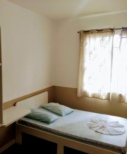 Postel nebo postele na pokoji v ubytování Hotel Aruba