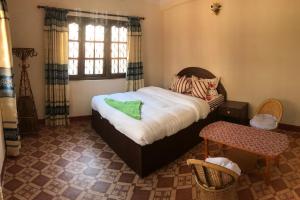 Postel nebo postele na pokoji v ubytování SUBI Home Stay