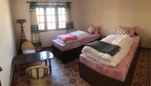 Postel nebo postele na pokoji v ubytování SUBI Home Stay