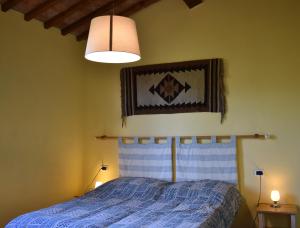 Postel nebo postele na pokoji v ubytování Casa Vacanze Valdicciola