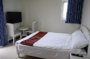 Łóżko lub łóżka w pokoju w obiekcie New Zhilan B&B