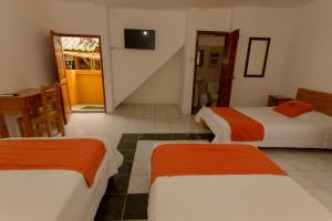Letto o letti in una camera di Tuzco Lodge