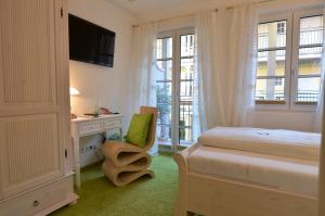 Postel nebo postele na pokoji v ubytování Landhaus Hotel Wolfratshausen