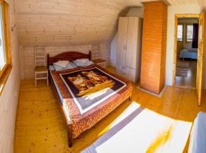 En eller flere senge i et værelse på Holiday Home with Sauna